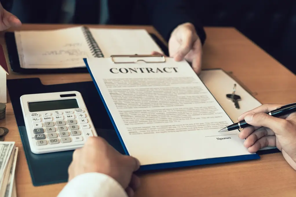 Business owner reviewing a commercial cleaning contract and quote from DBM